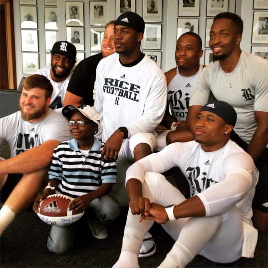 Driphus Jackson with Rice football players